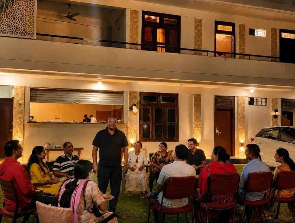 Guest enjoying a warm family-style stay at Rangoli Garden in Varanasi with comfortable accommodation and welcoming hospitality.