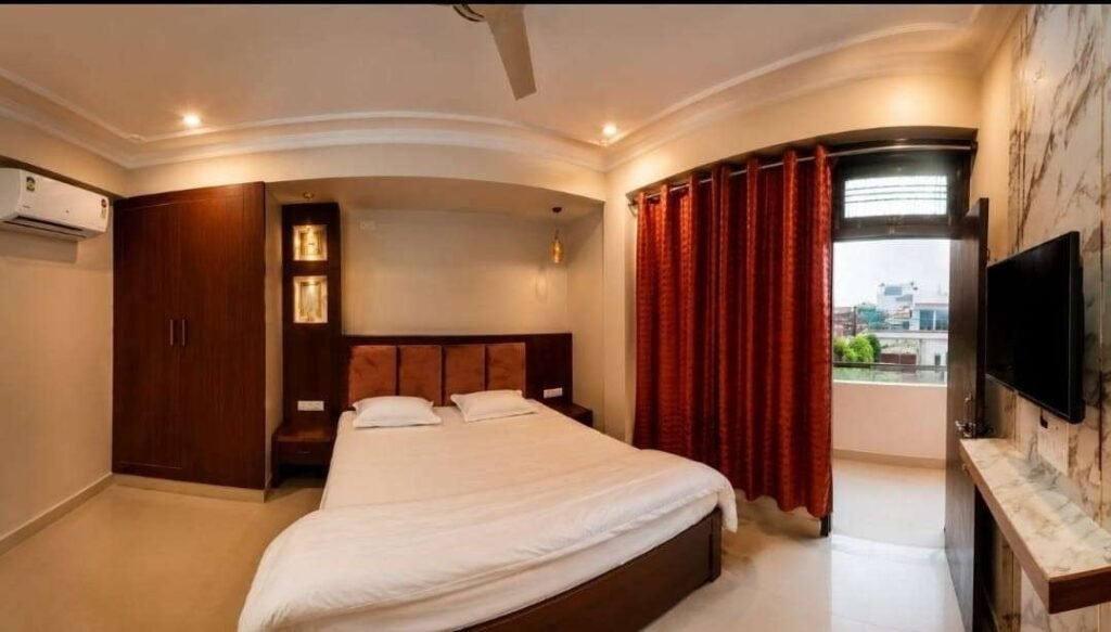 Luxury homestay room in Varanasi with elegant interiors and comfortable bedding